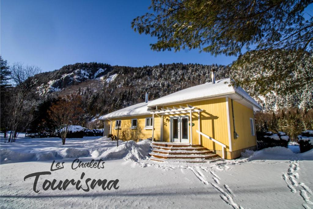 Les Chalets Tourisma - Chalet au bord de l'eau avec spa et foyer - Le Draveur