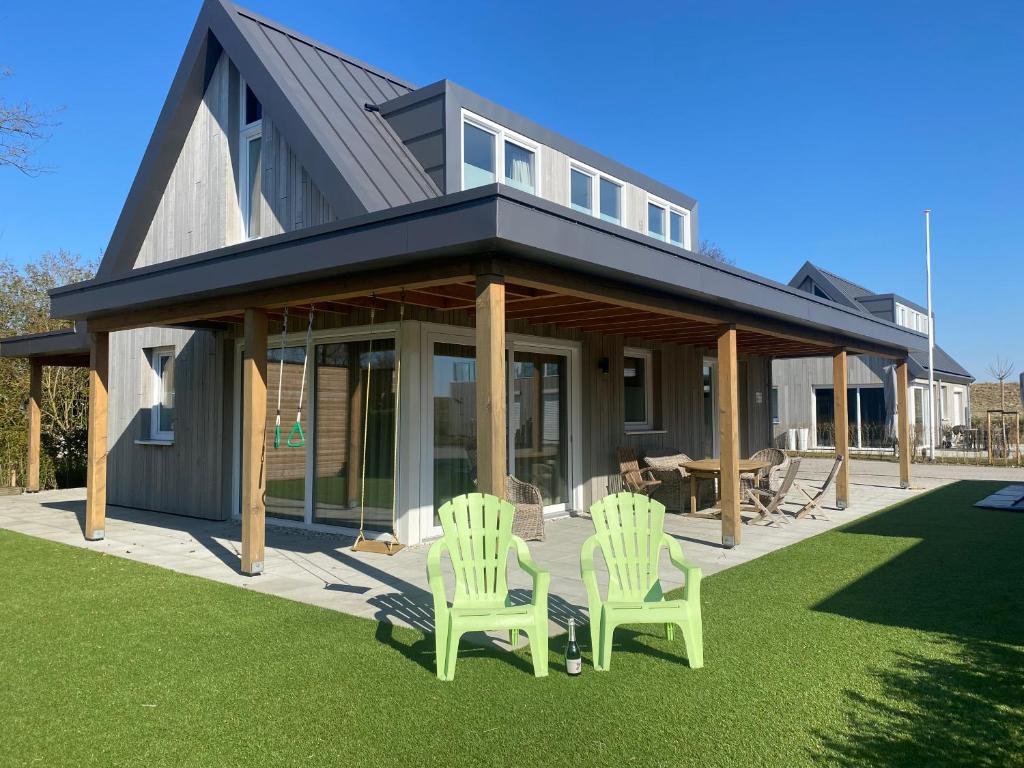 luxe Villa Maroma Regal aan Veerse Meer voor Jong en Oud met gratis 4 Ebikes, gasBBQ en Laadpaal