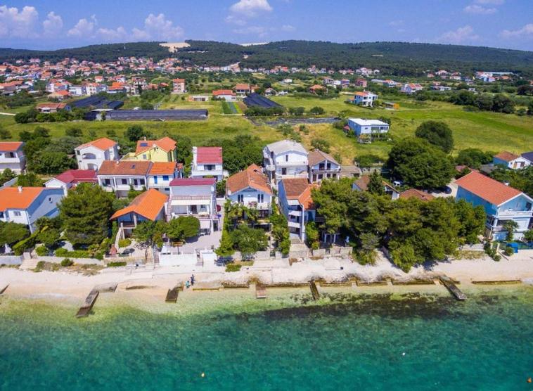 House first row by the sea